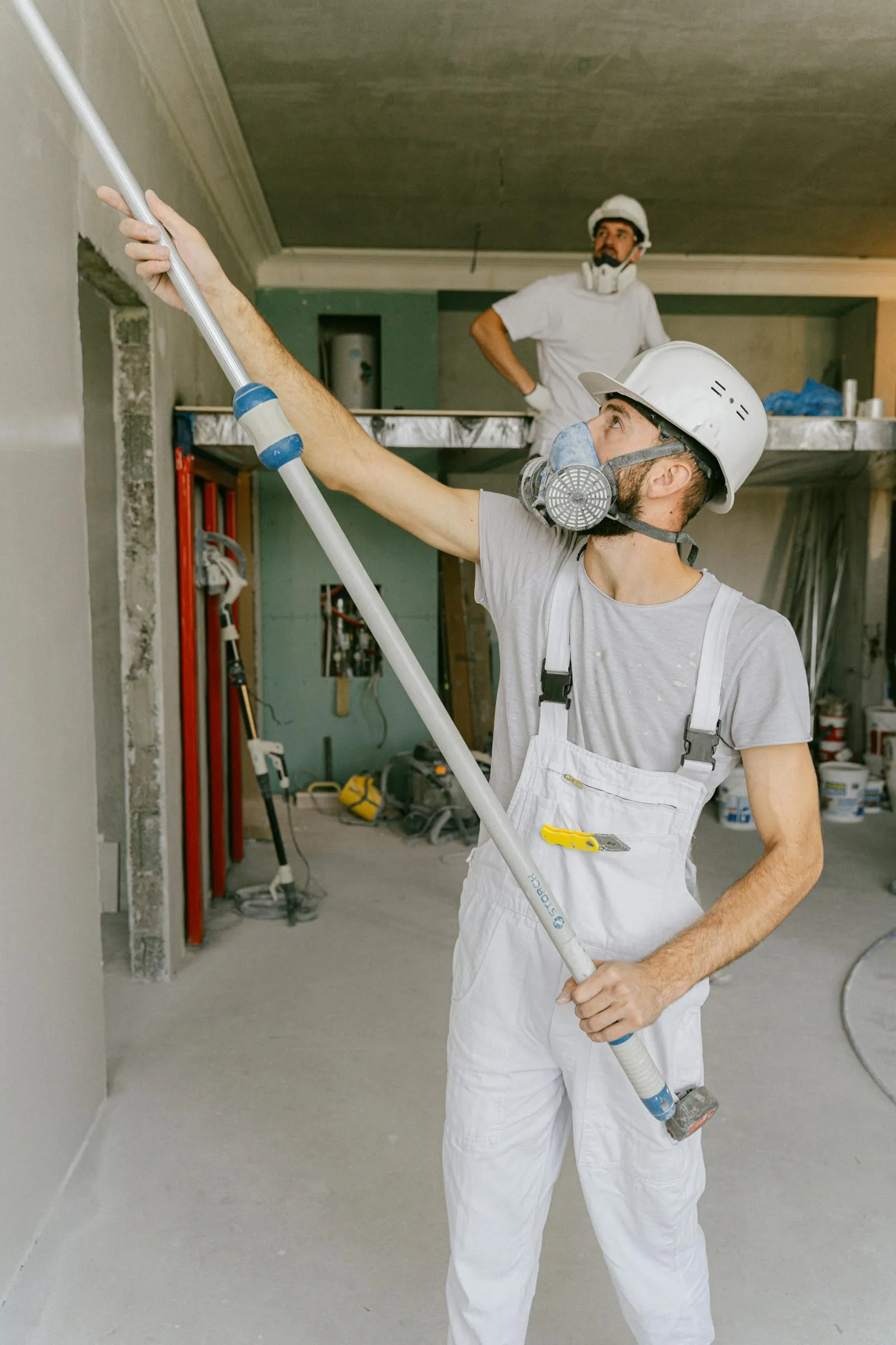 A painter at work on a site interior
